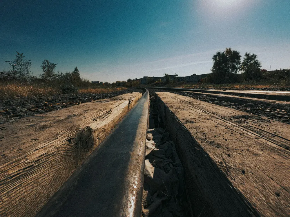 Long drainage channel cut through saturated ground after autumn rain
