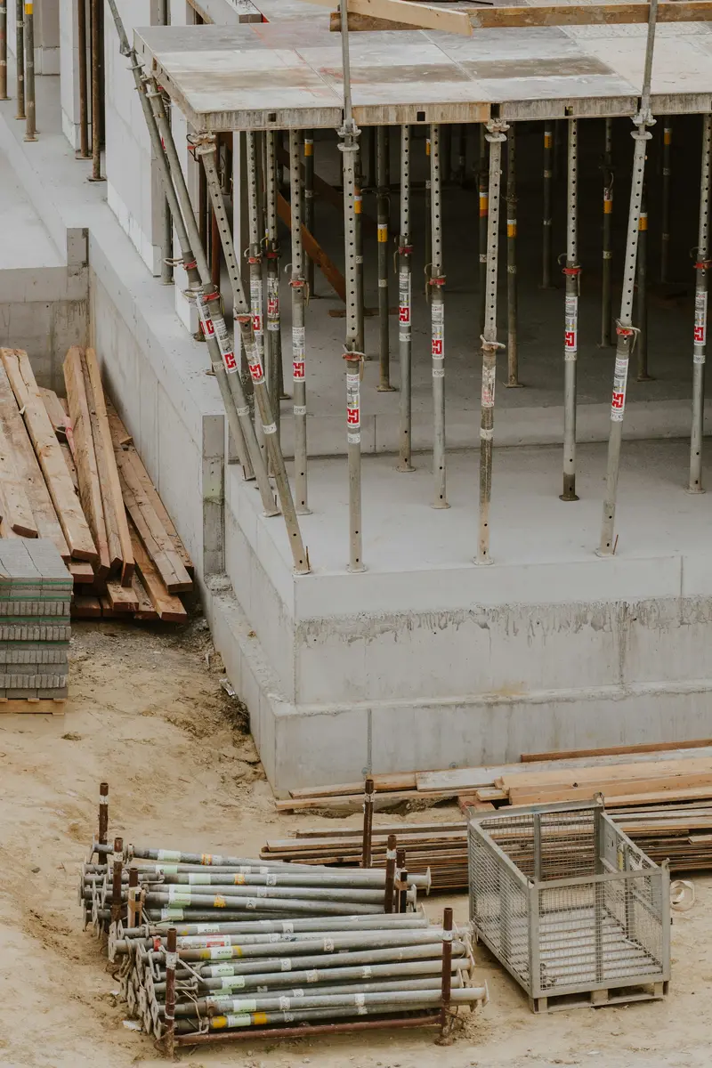 Poured concrete foundation wall with bracing and forms still in place